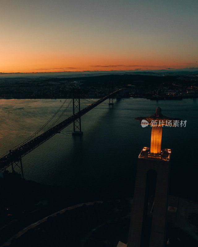 Cristo Rei statue and April 25th Bridge at sunset, Almada, Lisboa Region, Portugal